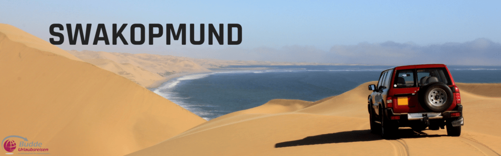 Abenteuer zwischen Dünen und Ozean Erkunden Sie Swakopmund, wo die goldene Wüste Namibs auf den kühlen Atlantik trifft. Dieses Bild fängt die einzigartige Lage von Swakopmund ein, ideal für Reisende, die den Nervenkitzel einer Wüstensafari mit der Frische einer Küstenstadt verbinden möchten. Lassen Sie sich vom Sand unter Ihren Füßen und dem Meeresrauschen in den Ohren verzaubern!